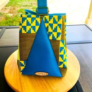 Cute adorable bag made with African fabric and faux leather.